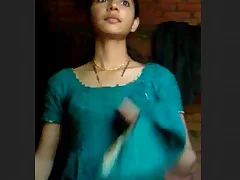 A young girl in a village undresses and exposes herself Her naked body attracts the attention of the people who are passing by and they cannot help but to gawp at her