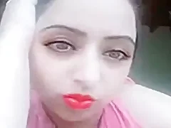 Desi MILF is a webcam performer and she is alone in this scene She is a brunette amateur and she has a great set of large natural breasts and she is fingering herself