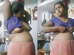 Beautiful Indian house wife in sexy nightie changing clothes in a rather provocative manner Her looker plus sexuality are revealed in every single impersonate she takes plus shtick she makes